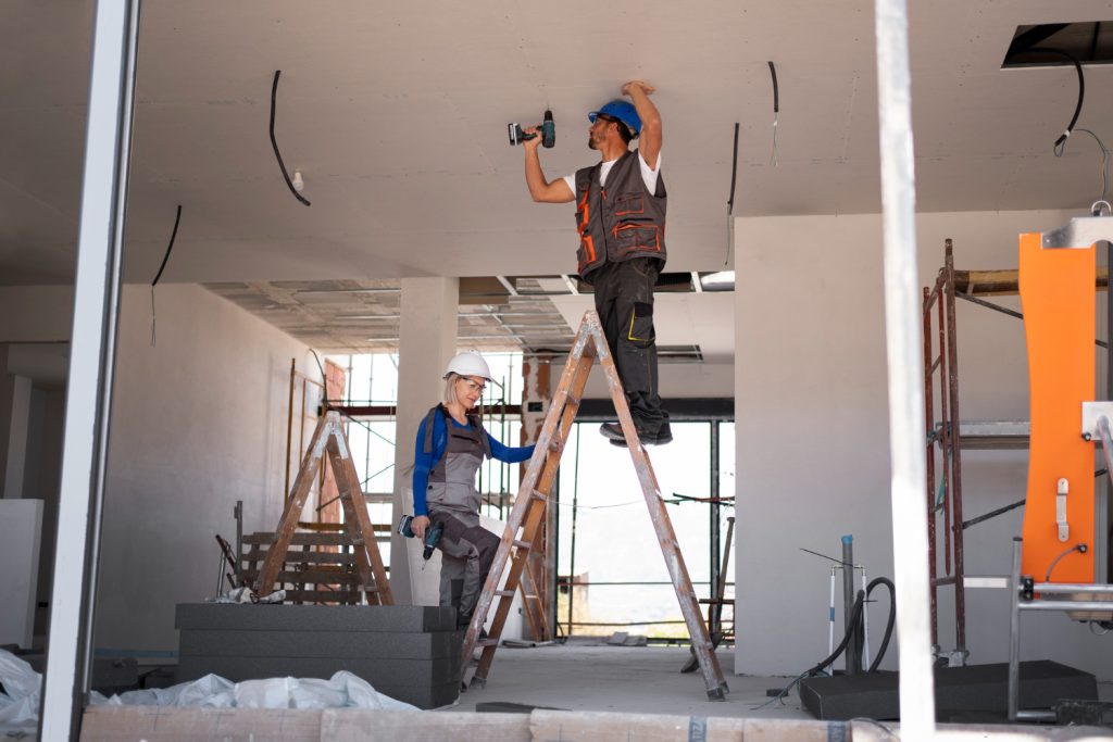 Contractor reviewing home remodel permit requirements with Austin homeowners